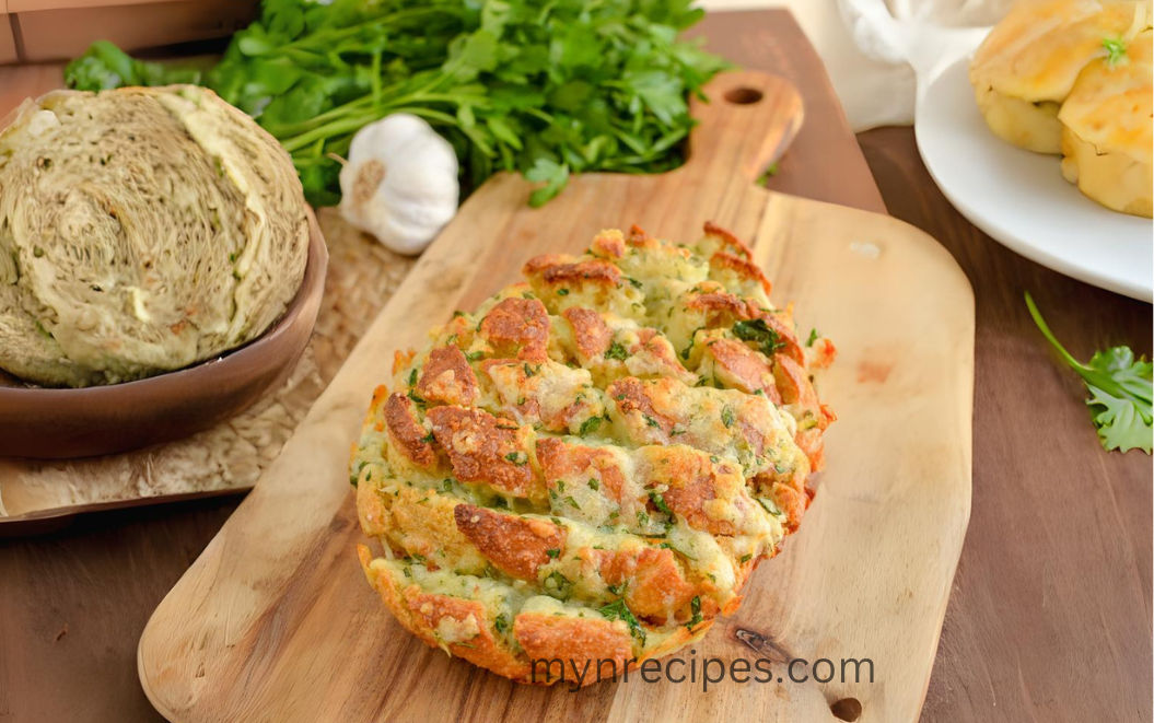 Cheesy Garlic Oat Bread Craving a savory, cheesy, and utterly irresistible snack or appetizer? Look no further than this oat bread pull-apart masterpiece! Forget store-bought options and whip up this flavor explosion in your own kitchen. It's easier than you think and packed with surprising benefits Thi is the softest cheesiest garlic bread you'll ever try! This recipe for oat bread with garlic and cheese offers several benefits beyond just being delicious: Fiber Power: Oats are a good source of fiber, which can aid digestion and keep you feeling fuller for longer. This can be especially helpful when enjoying a cheesy, indulgent dish. Lower Fat: By using fat-free Greek yogurt instead of full-fat alternatives, you reduce the overall fat content of the recipe without sacrificing flavor or creaminess. Controllable Ingredients: Making your own bread allows you to control the ingredients you use, potentially avoiding unwanted additives or excess sodium often found in store-bought options. About Time: Prep Time: 15 mins Cook Time: 45 mins Total Time: 1 Hour Yield:3 Serves Syn Free Ingredients: Oat Flour Power: 120g (4.3oz) of Oats (rolled or quick) Leavening : 1.5 teaspoons of baking powder pinch of salt 2 large eggs 120g (4.3oz) of Fat-Free Plain Greek Yoghurt and cooking oil spray, create a moist and flavorful base. Cheese 50g (1.8oz) mozzarella, grated and 60g (2.2oz) of strong white cheddar, grated for gooey, melty goodness. Garlic: 2-3 cloves of garlic, crushed for that irresistible aroma and flavor punch. fresh finely chopped parsley, for a pop of color and brightness. Instructions: Preheat oven to 180c/fan 160c/350f (gas mark 4) and line a baking dish with parchment paper. Blend the oats in a blender or food processor until a fine powder. Add to a bowl with the baking powder, a pinch of salt, Greek yoghurt and eggs. Pour the batter into your prepared baking dish and bake for 40 minutes, or until a skewer inserted in the center comes out clean. While the bread cools, crank up the oven to 200°C (400°F). Add the cheddar, mozzarella, garlic cloves, fresh parsley to a bowl, and crumble all together with clean hands. Once the bread is cool enough to handle, use a sharp knife to carefully cut diagonal slits, making sure not to cut all the way through. Gently pull open the slits to create pockets for the cheese mixture. carefully pull slits open, season with a little salt and spray with a little spray oil. Stuff with the cheese garlic mixture. Place back in the dish and bake for approx 10-12 minutes, cheese should be melted and lightly golden. Serve warm, dig in, pull-apart and enjoy!! Tips for an even better bake: For a richer flavor, use full-fat Greek yogurt instead of the fat-free version. Add a sprinkle of your favorite herbs or spices to the cheese mixture for a customized flavor twist. Drizzle the finished bread with melted butter or olive oil for an extra touch of decadence. This recipe is sure to become a crowd-pleaser, whether you're enjoying it with family, friends, or just indulging in a solo treat. So go ahead, get your hands dirty, and savor the deliciousness of this cheesy, garlicky oat bread masterpiece!