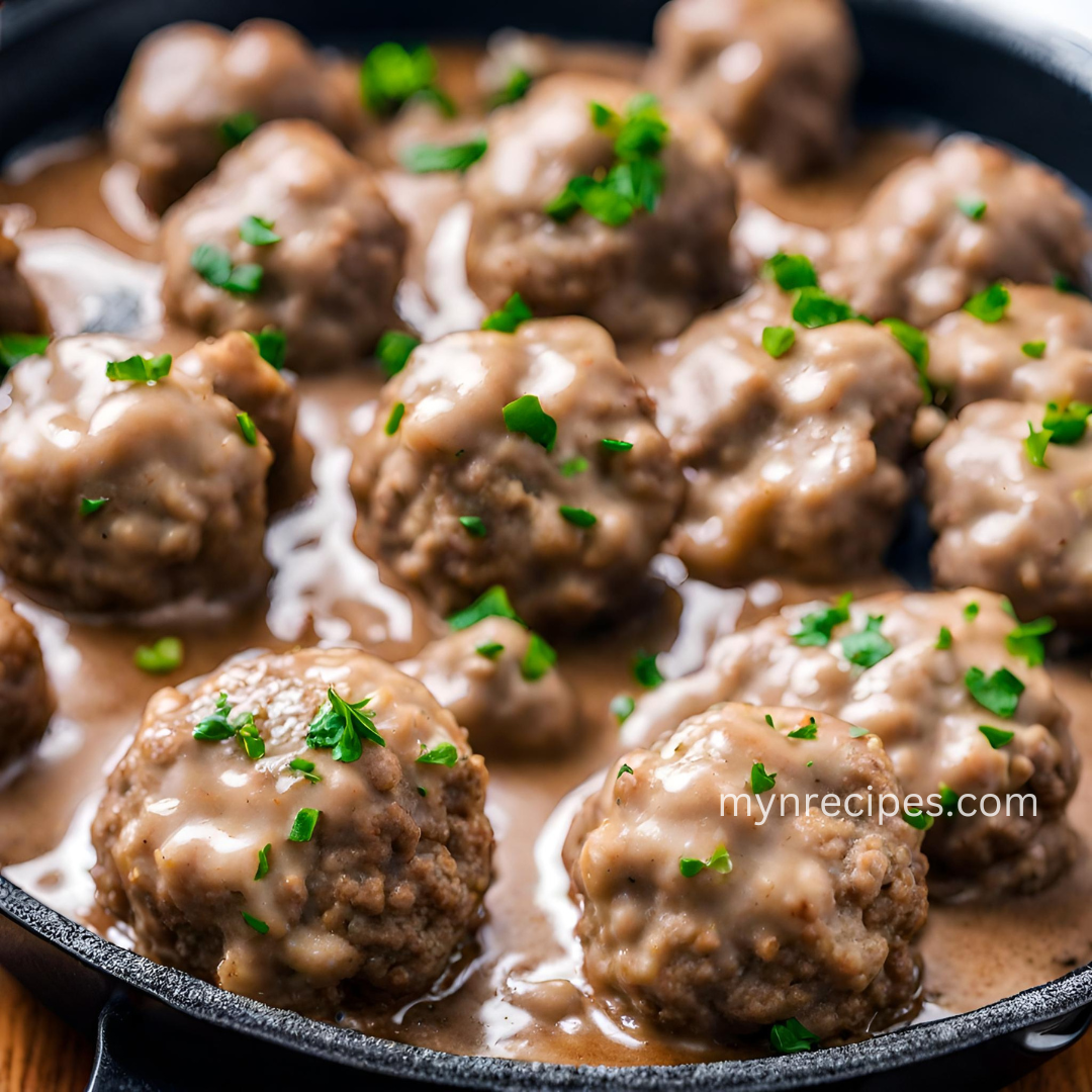Swedish meatballs Recipe Craving comfort food that fits your Slimming plan? Look no further than these Swedish-inspired Meatballs! These tender, flavorful meatballs are simmered in a light and savory gravy, all while staying completely Free on your Slimming World journey. Packed with protein and bursting with warming spices, this recipe is sure to satisfy without derailing your goals. Here's what makes them special: Free: Enjoy a hearty meal without using any of your syns! Flavorful and satisfying: Warm spices like nutmeg and rosemary add depth to the meatballs and gravy. Customizable: Swap the pork mince for turkey or chicken, or adjust the vegetables to your liking. Easy to make: Ready in just 35 minutes, this recipe is perfect for a busy weeknight dinner. So ditch the takeout and whip up a batch of these delicious Swedish-inspired Meatballs. Your taste buds and your Slimming plan will thank you! About Time: Prep Time: 15 mins Cook Time: 35 mins Total Time: 50 mins Yield: 4 Ingredients: Meatballs: 750g lean mince (5% fat or less) 1 small onion, finely chopped 1 large garlic clove, crushed ¼ tsp freshly grated nutmeg ½ small bunch fresh dill, chopped (reserve some for garnish) 1 medium egg, beaten Salt and black pepper to taste Gravy: 300ml boiling chicken stock 1 tsp chopped fresh rosemary 1 tsp tomato purée 2 tsp Worcestershire sauce 1 tsp dark soy sauce 1 level tsp cornflour 150g plain quark 2 tbsp fat-free natural Greek yogurt ½ tsp paprika Serving: Tagliatelle pasta (optional) Green vegetables (optional) Instructions: Make the meatballs: In a large bowl, combine mince, onion, garlic, nutmeg, chopped dill, egg, salt, and pepper. Mix well. Shape the mixture into 28 meatballs, each about the size of a golf ball. Cook the meatballs: Heat a large non-stick frying pan with low-calorie cooking spray over medium-high heat. Add the meatballs in batches and fry for 8 minutes per batch, or until golden brown and cooked through. Keep cooked meatballs warm under foil. Prepare the gravy: In the same pan, whisk together chicken stock, rosemary, tomato purée, Worcestershire sauce, soy sauce, and seasoning. Bring to a simmer. Thicken the gravy: Return the meatballs to the pan and simmer gently until heated through. In a separate bowl, whisk cornflour with 6 tablespoons of quark. Gradually add this mixture to the pan, stirring constantly until the sauce thickens slightly. Make the "soured cream": Combine remaining quark with yogurt, paprika, reserved dill, and seasoning. Serve: Arrange meatballs on plates with gravy. Top with "soured cream" and garnish with fresh dill. Enjoy with a side of tagliatelle pasta and green vegetables (optional). Tips: For extra flavor, add a pinch of allspice to the meatball mixture. Leftover meatballs can be stored in an airtight container in the refrigerator for up to 3 days. Reheat gently in a pan or microwave. Substitute tagliatelle with another type of pasta or serve over mashed potatoes. Enjoy this delicious and Slimming World-friendly meal!